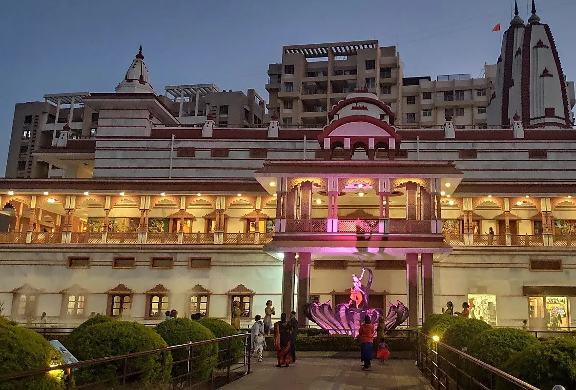 A temple lit up at dusk